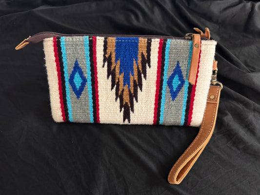 Tan tooled leather saddle blanket clutch