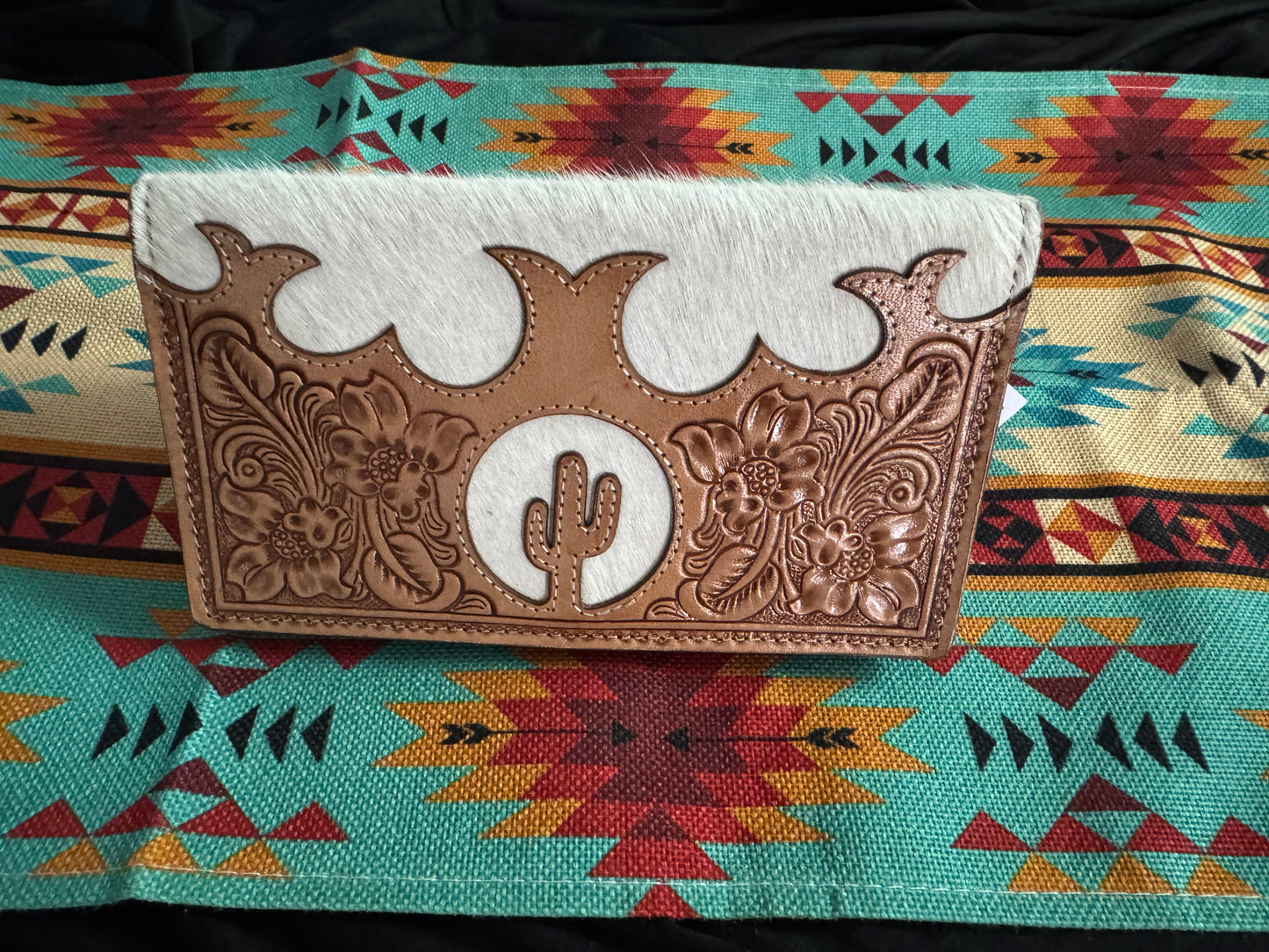 Cactus design, hand tooled leather and cow hide wallet.